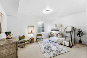Bedroom with carpet and a textured ceiling