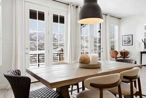Dining room featuring light wood-style floors and a mountain view