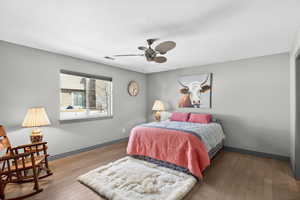 Bedroom featuring hardwood / wood-style flooring and ceiling fan