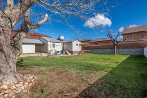 Fenced yard featuring a patio and entry steps