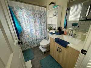 Bathroom with vanity and toilet