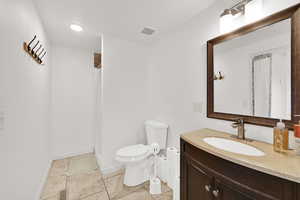 Bathroom with vanity and a shower stall
