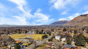 View of mountain backdrop featuring nearby suburban area
