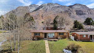 View of front facade with brick siding and a mountain view