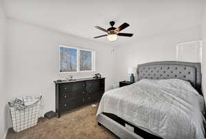 Bedroom with carpet flooring and a ceiling fan