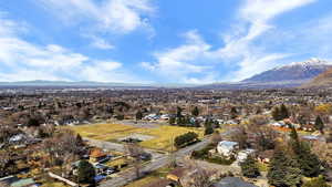 Aerial view of residential area featuring a mountain backdrop