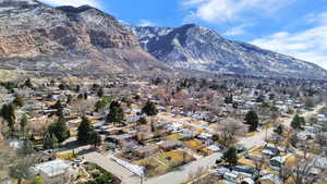View of mountain backdrop featuring nearby suburban area