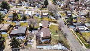 Aerial view of property's location with nearby suburban area