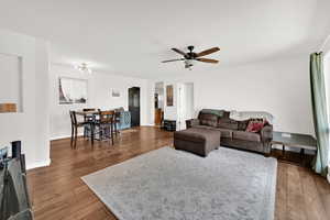 Living area featuring wood-type flooring and ceiling fan