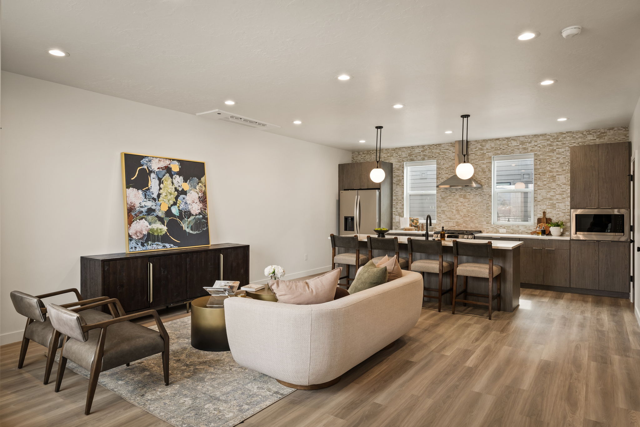 Living area featuring light wood-style flooring and recessed lighting
