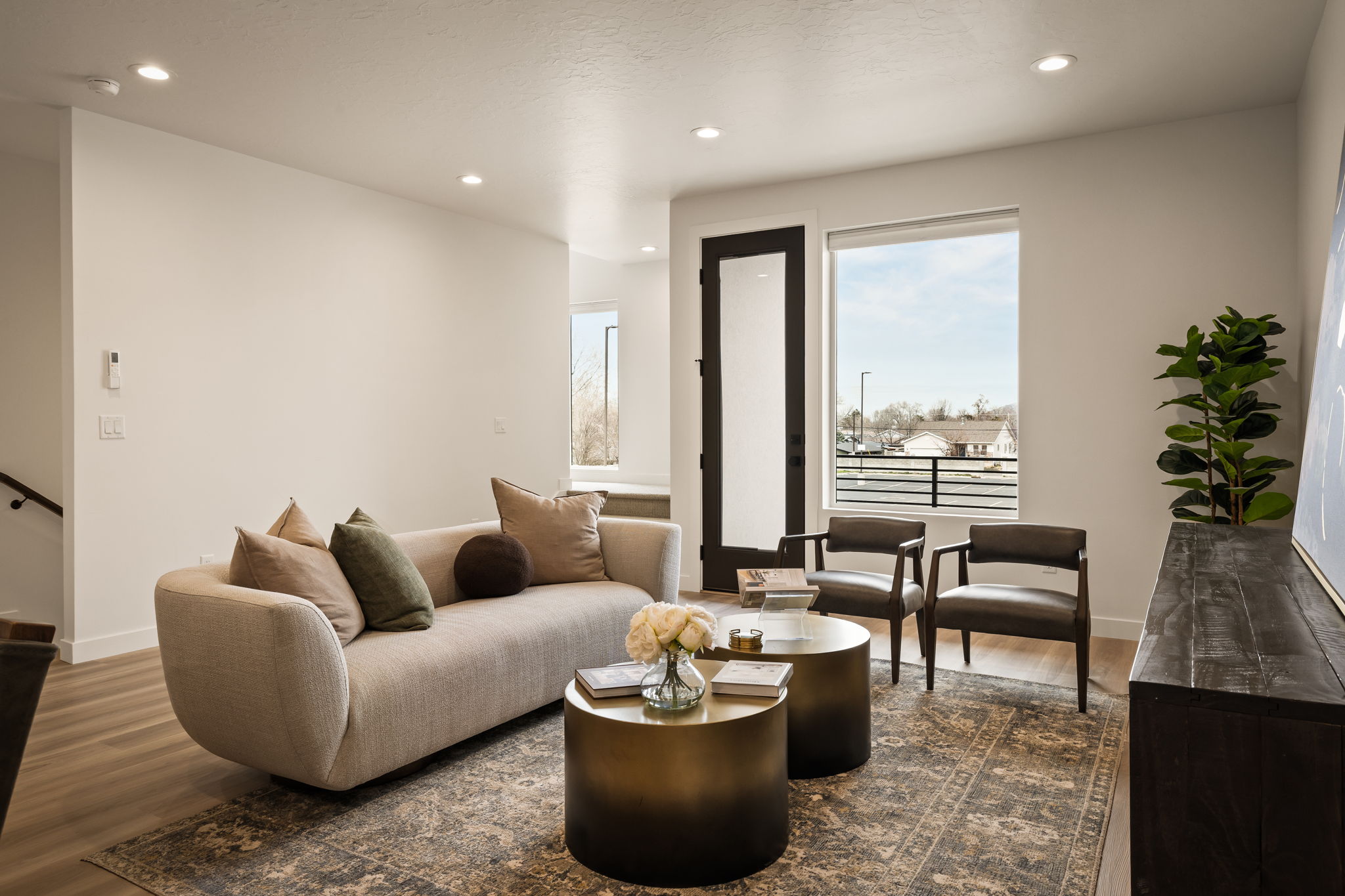 Living area featuring recessed lighting and dark wood-style floors
