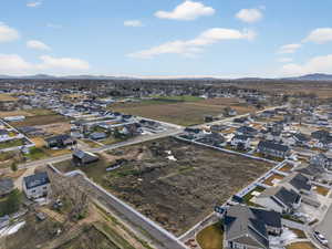 Aerial perspective of suburban area featuring a mountainous background