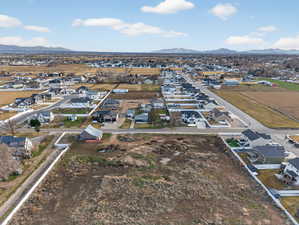 Aerial perspective of suburban area with a mountainous background