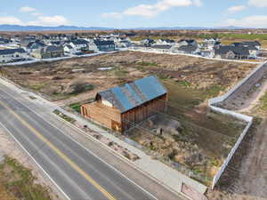 Aerial view of residential area featuring a mountainous background