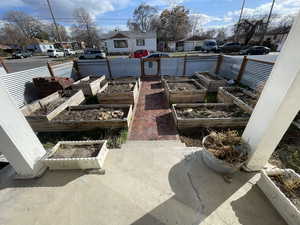 View of yard featuring a garden and a residential view
