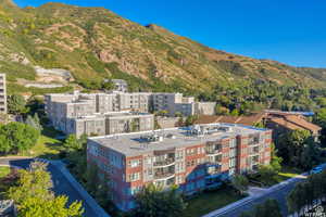 Drone / aerial view of mountains and apartment complex / building