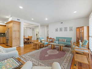 Open Living room looking to dining area and kitchen.