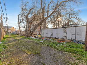 View of yard featuring an outdoor structure and a pole building