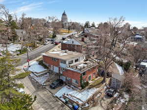 Snowy aerial view featuring a residential view