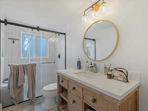 Bathroom featuring vanity and a stall shower