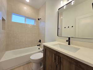 Bathroom featuring vanity and  shower combination