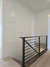 Staircase featuring wood finished floors