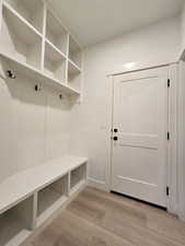 Mudroom with light wood-type flooring
