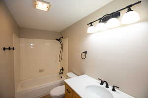 Updated full bath featuring vanity and shower / bathtub combination