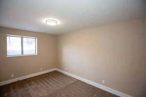 Bedroom 6 with carpet floors and baseboards