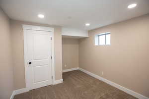 Bedroom 5 featuring dark carpet and recessed lighting