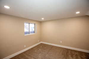 Large carpeted bedroom 3 featuring baseboards and recessed lighting