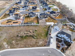 Aerial view of property and surrounding area with nearby suburban area