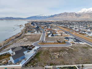 Aerial perspective of suburban area featuring a water and mountain view
