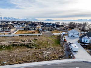 Aerial view of residential area featuring mountains
