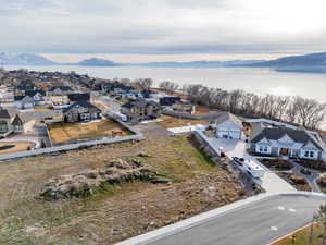 Aerial view of residential area featuring a water and mountain view