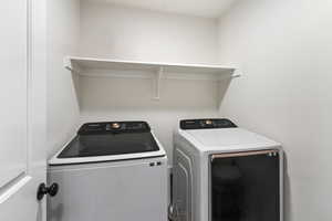 Laundry area featuring independent washer and dryer