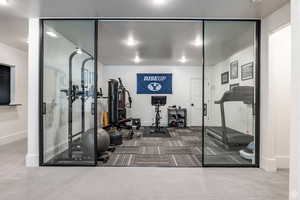 Workout area with carpet floors and glass walls