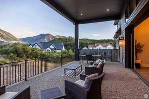 View of patio with a mountain view and outdoor furniture