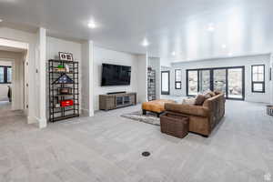 Living room featuring light carpet and recessed lighting