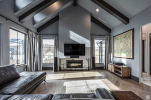 Living room with parquet floors and a premium fireplace