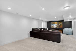 Living room featuring light carpet and recessed lighting