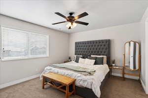 Bedroom featuring carpet floors and a ceiling fan