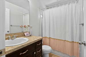 Bathroom featuring vanity and a shower with shower curtain