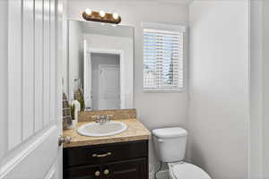 Bathroom featuring toilet and vanity