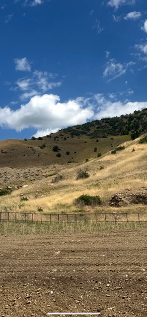 View of mountain background featuring rural landscape