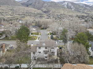 Aerial perspective of suburban area featuring a mountainous background