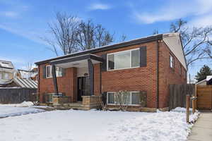 View of front of property with brick siding