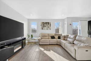 Living area with wood tiled floors and recessed lighting