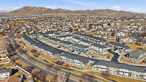 View of property location with a mountain backdrop and nearby suburban area