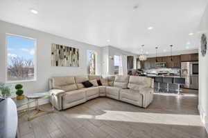 Living room with wood finish floors and recessed lighting